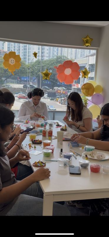 Participants making miniature figures