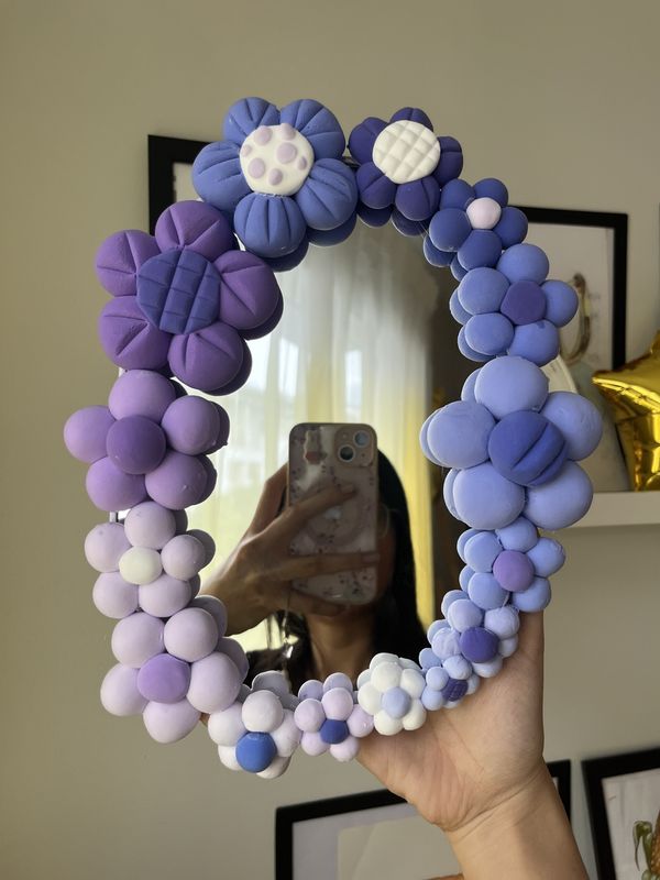 A hand-decorated mirror made at a craft session